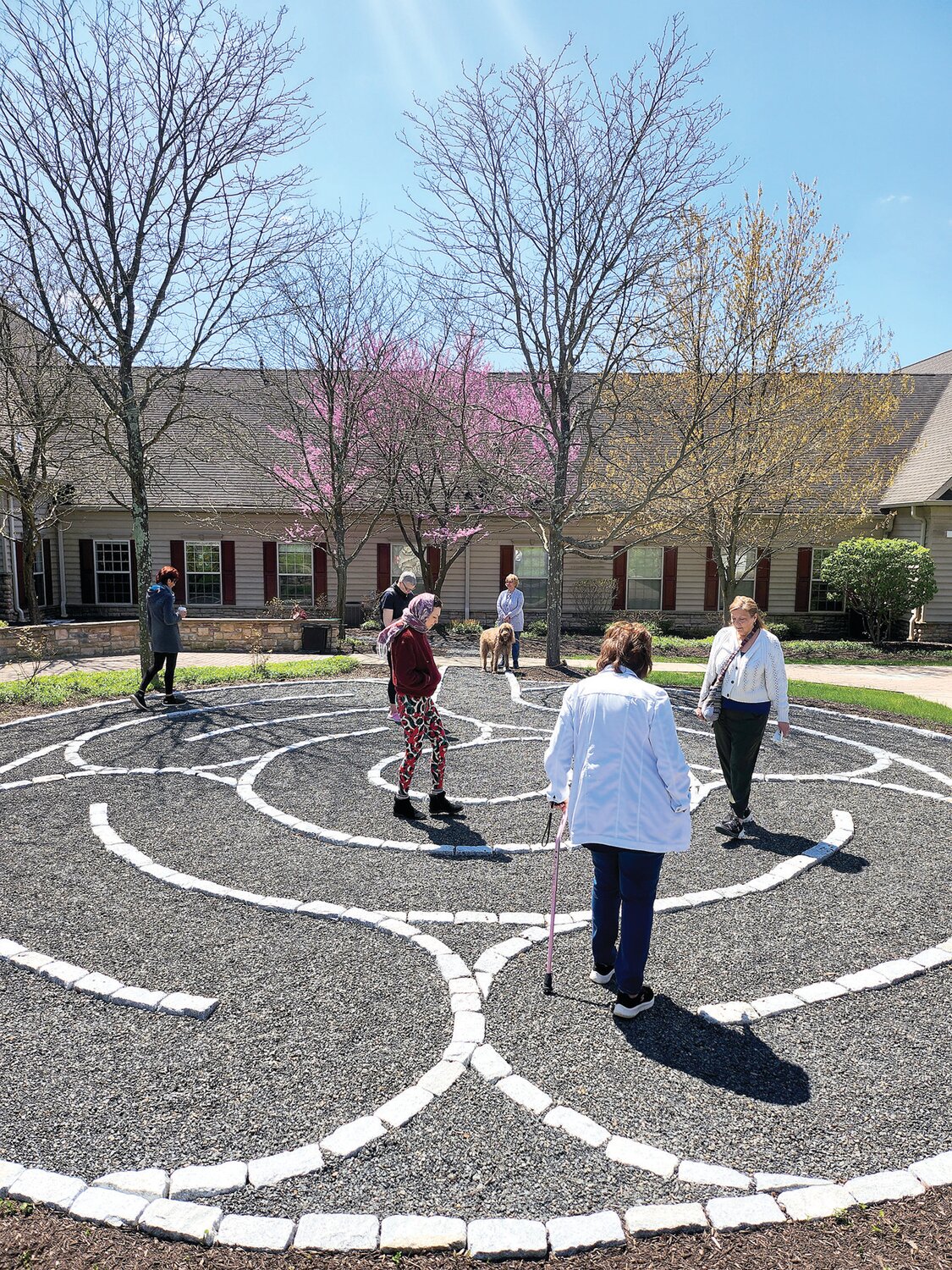 Guests of Kin Wellness and Support Center walk the new labyrinth.