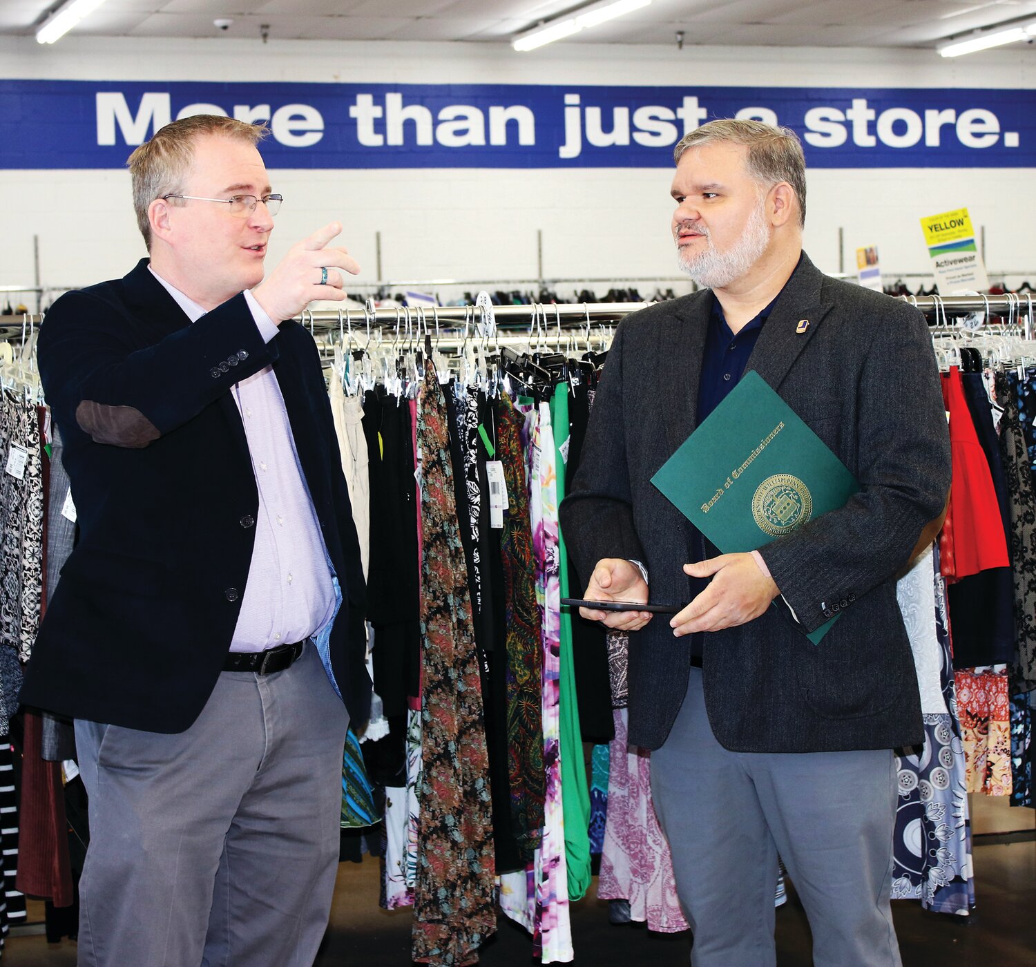 State Rep. Brian Munroe, left, and Goodwill Keystone Area President and CEO Ed Lada talk inside the store.