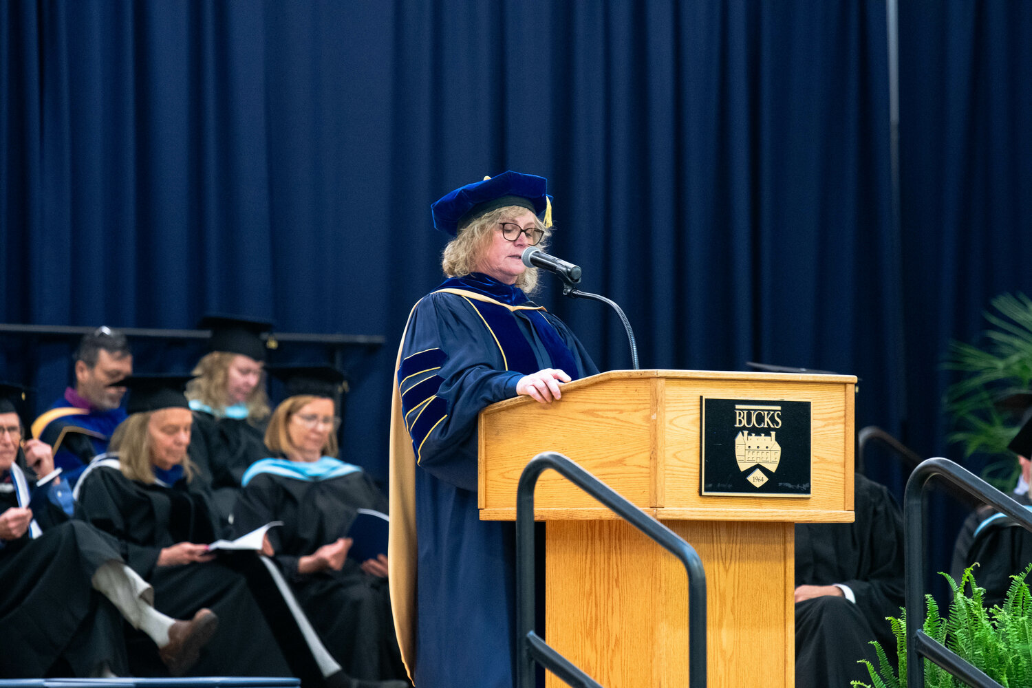 Bucks County Community College Provost Dr. Kelly Kelleway welcomes graduates and their guests to a May 16 commencement ceremony.