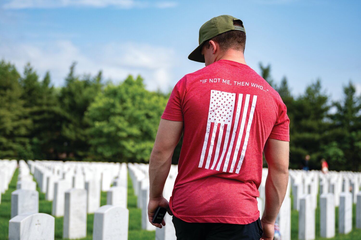 Joe Verrekia walks through Washington Crossing National Cemetery. On Memorial Day, the Travis Manion Foundation hosted an Honor Project event in which volunteers placed handcrafted commemorative tokens at the resting places of fallen heroes.