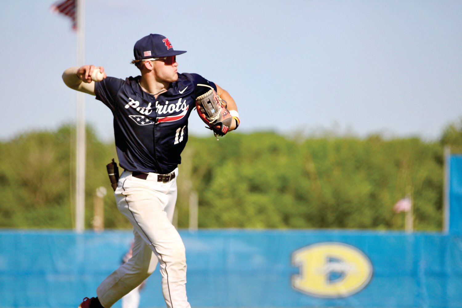 Central Bucks East senior third baseman Chase Harlan makes a throw during Tuesday’s District One 6A semifinal game against Downingtown West.