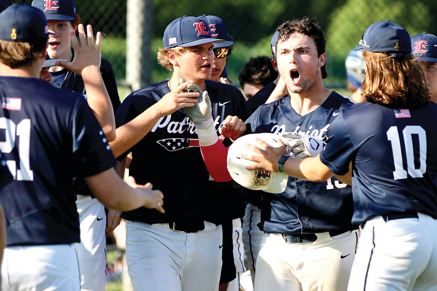 Jack Mislan and teammates celebrate his home run.