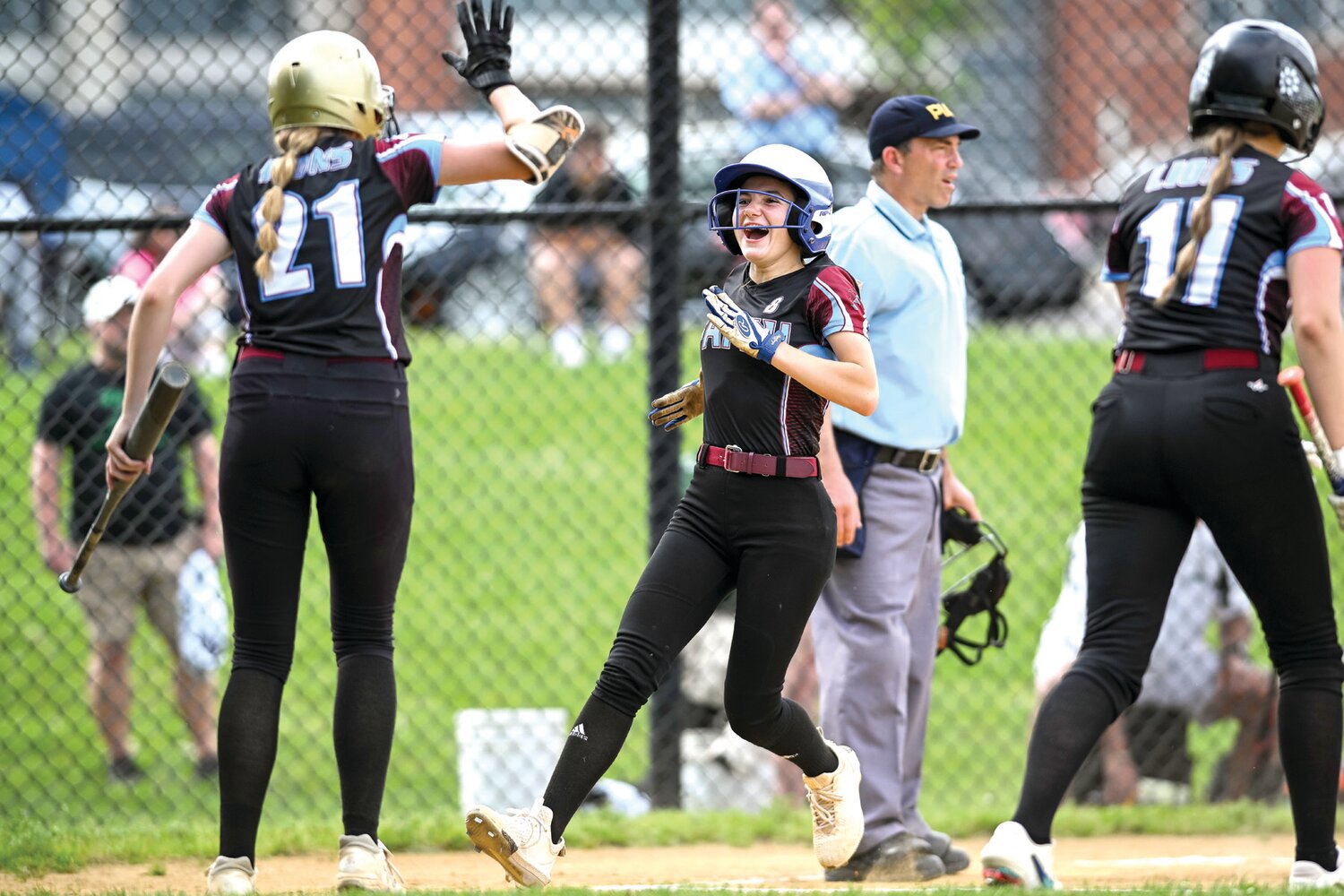 Faith Christian’s Cheyenne Greene after scoring in the third inning, putting Faith Christian up 2-1.