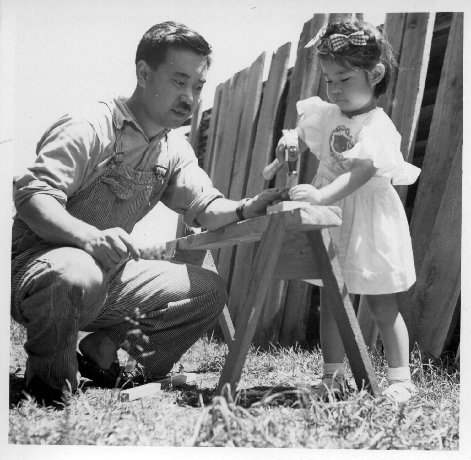 A young Mira Nakashima helps her father, George.
