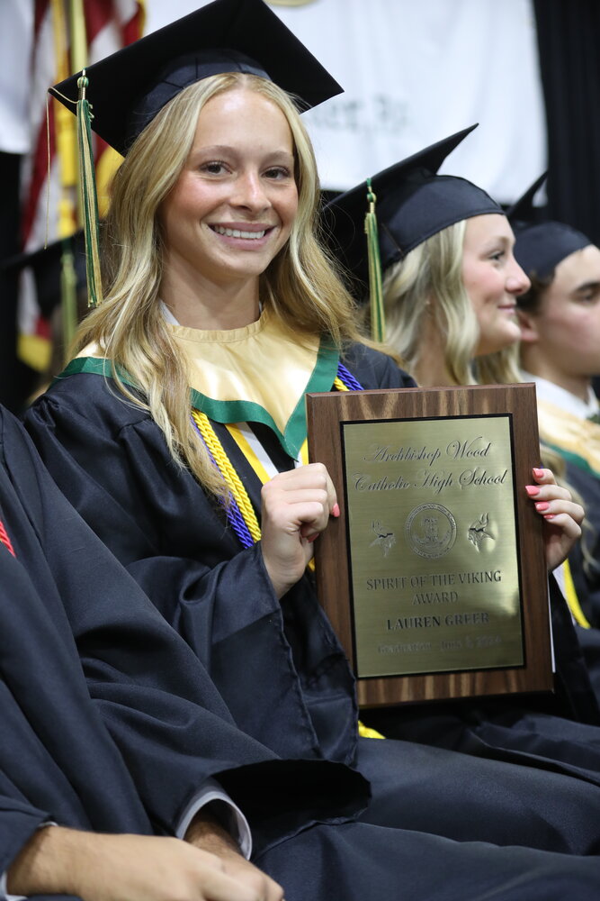 Lauren Greer displays the “Spirit of the Viking Award” at Archbishop Wood High School’s graduation ceremony.