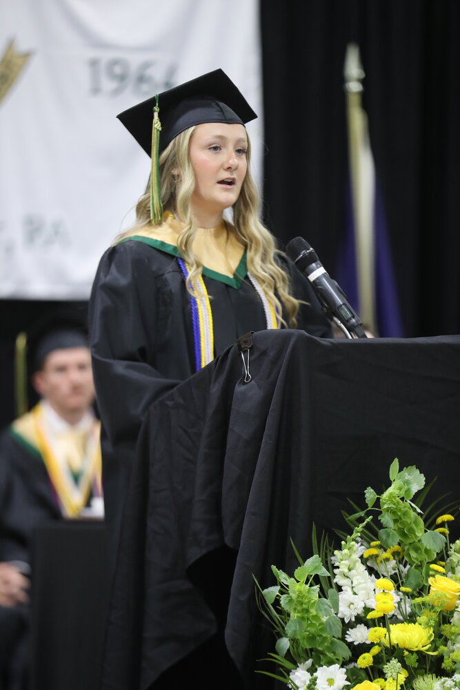Molly Kimble, one of two seniors chosen to address the Archbishop Wood High School Class of 2024, speaks during Monday’s commencement ceremony.