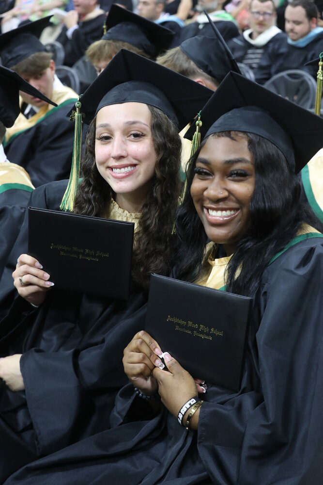 Graduates were all smiles as they hold their hard-earned diplomas during Monday’s Archbishop Wood High School graduation ceremony.