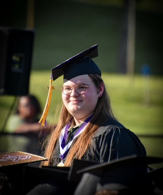 Owen Brandes gives a smile during the Palisades High School graduation on May 31.