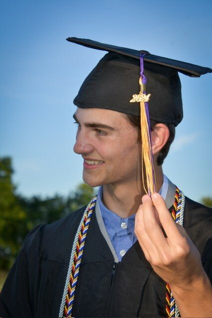 Mason Campbell has turned his cap’s tassel to the left side, signifying that he has graduated.