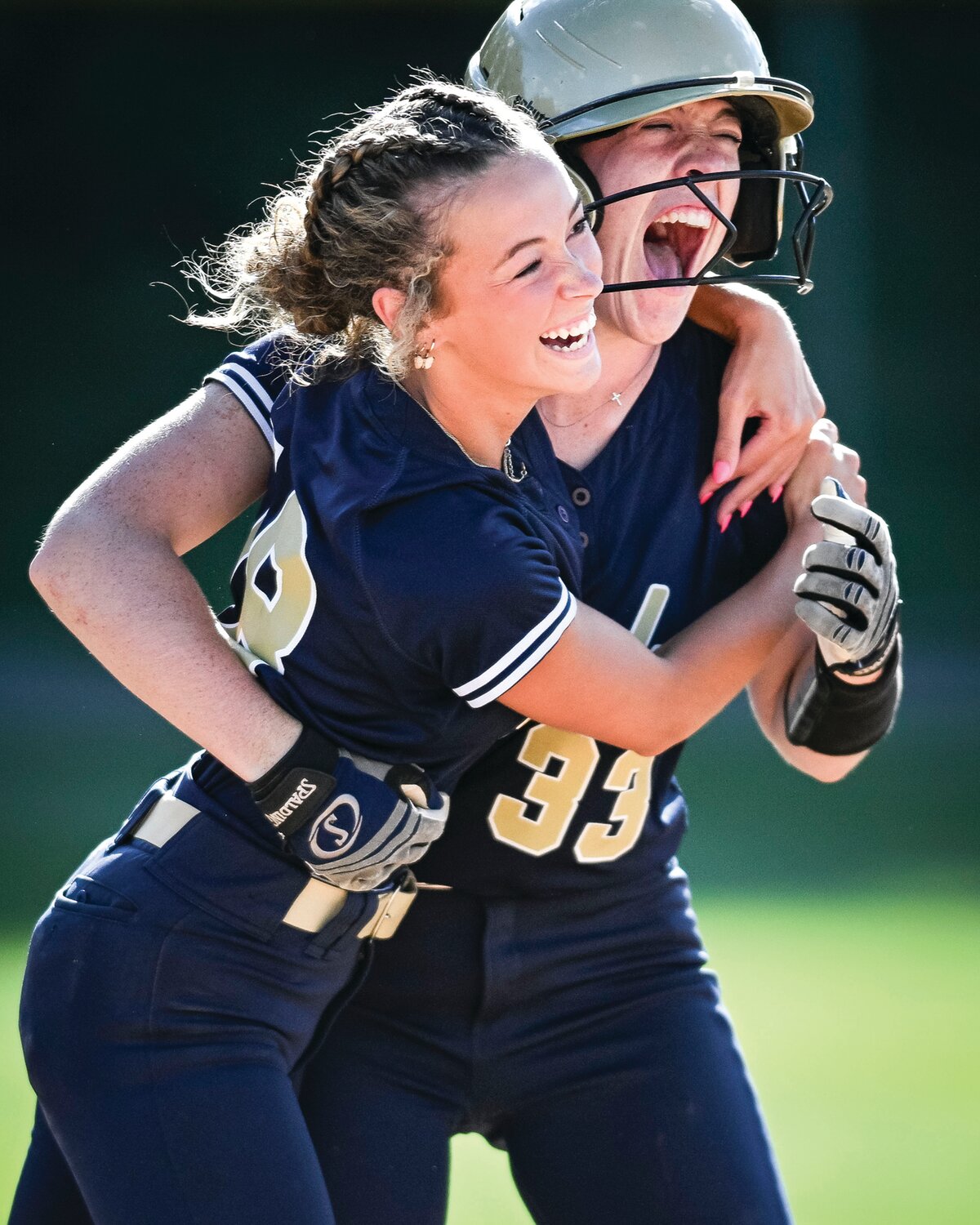 Council Rock South’s Maddie McLean hugs Shannon Williams after her game-winning walk-off hit.