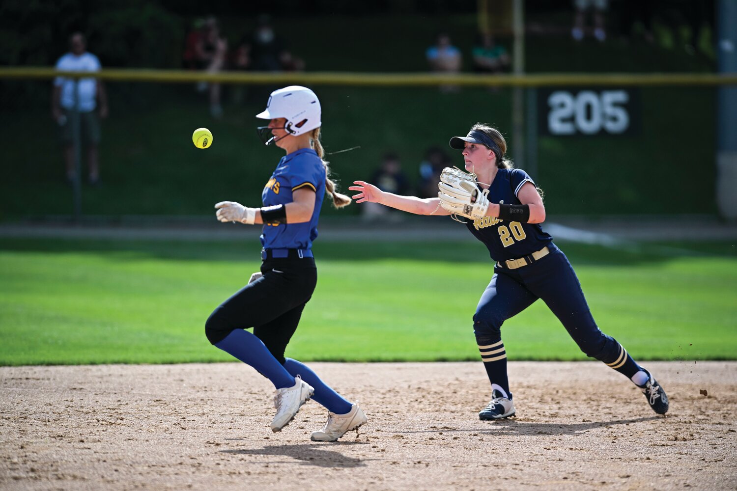 Council Rock South second baseman Kelly Delise flips the ball ahead of Downingtown East baserunner Jade Jenkins in the fourth inning.