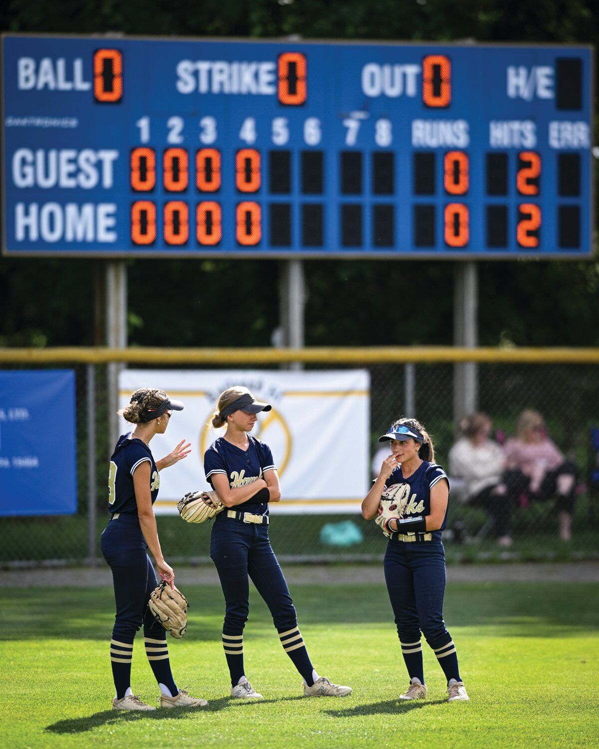 Council Rock South outfielders, from left, Maddie McLean, Helen Woloshyn and Gabby Bloom await the start of the fifth inning.