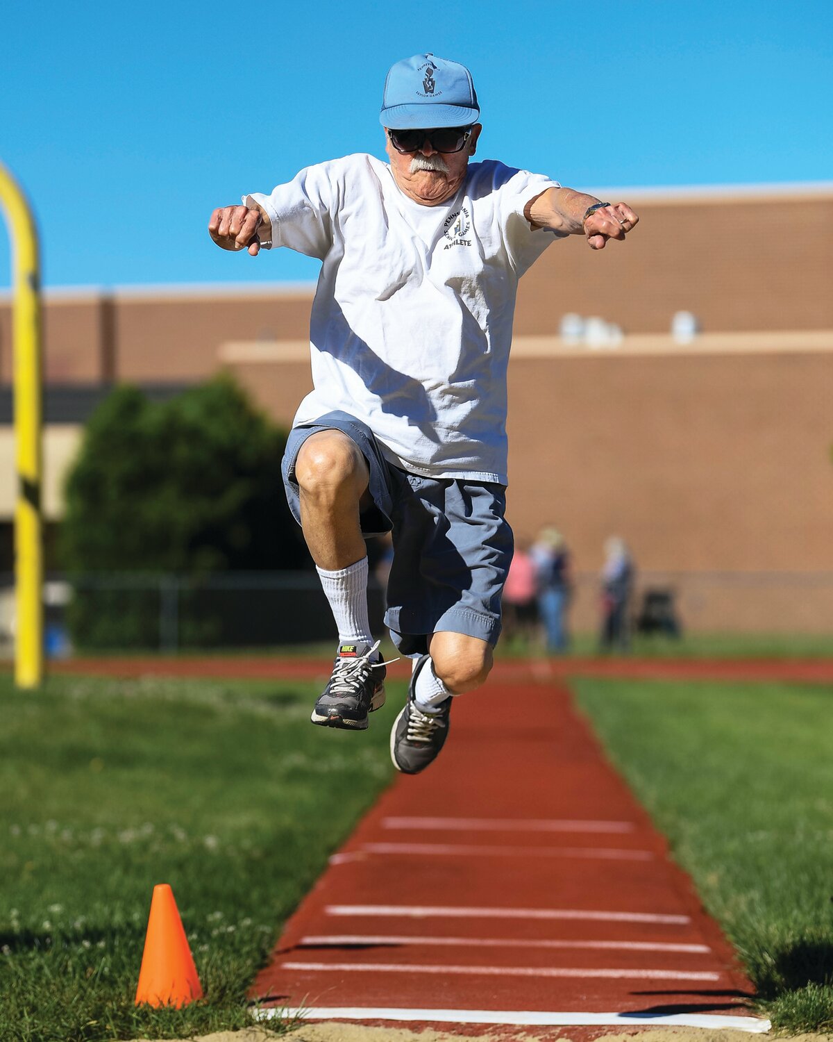George Shackett competes during the long jump.