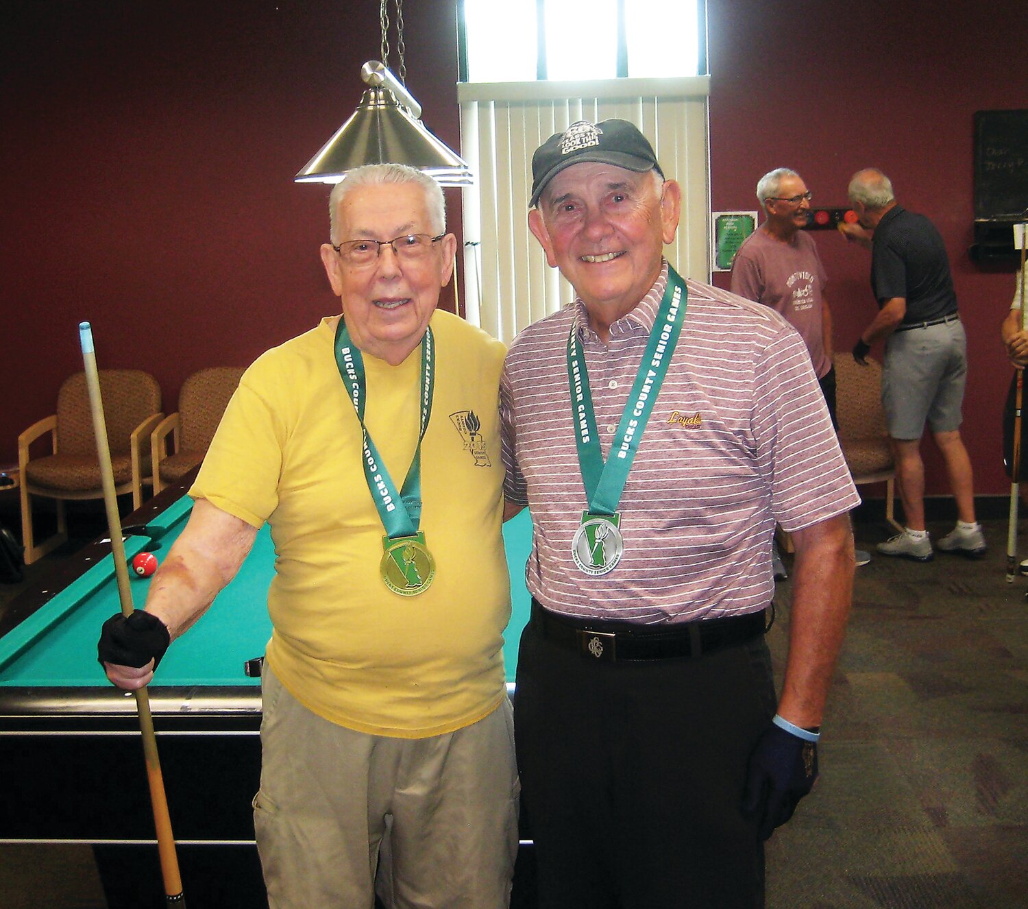 Bucks County Senior Games men’s age 80-89 billiards medalists, from left: Bob Lawrence, gold, and Ron Mokos, silver. Missing: bronze medalist Michael Short.