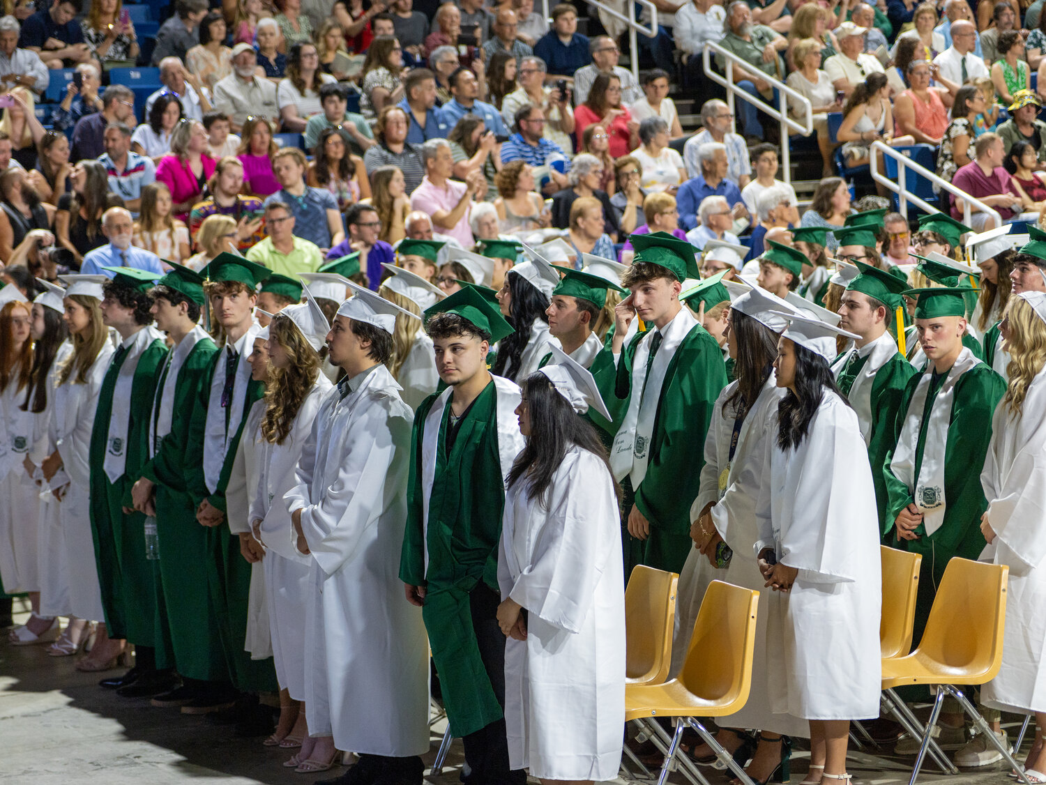 Graduates stand at attention during the Pennridge commencement ceremony.