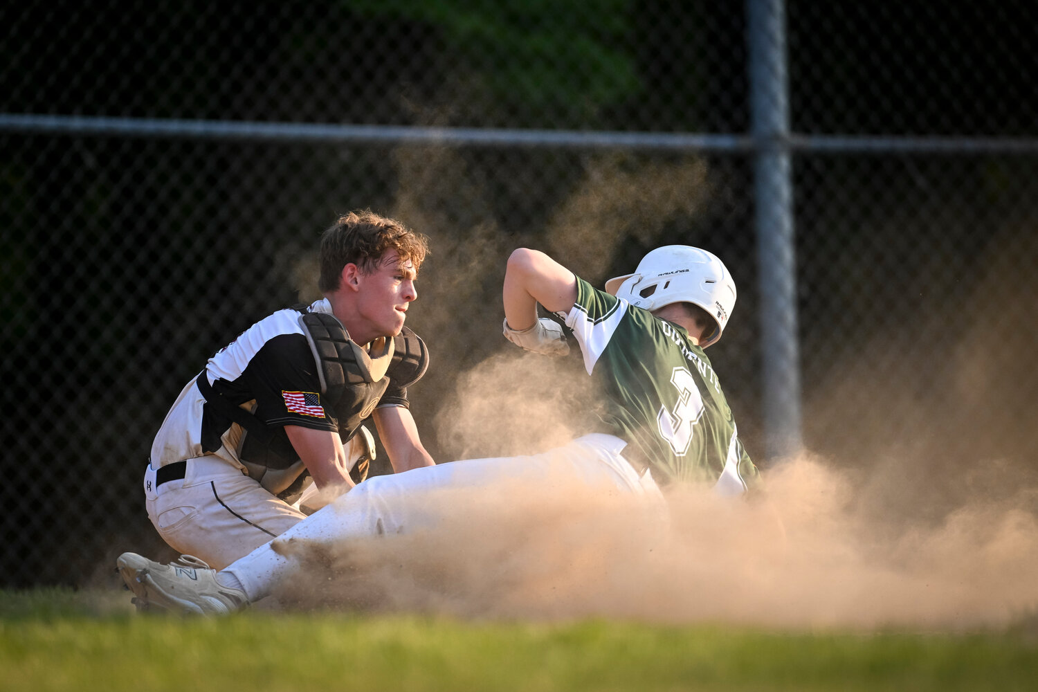 Hatfield-Towamencin catcher Mason Scovronski applies the tag as Pennridge’s Anthony Diamente tries to score from second base in the second inning.