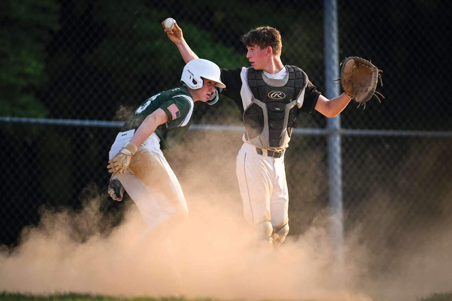 Hatfield-Towamencin catcher Mason Scovronski shows the ball after Pennridge’s Anthony Diamente tries to score from second base in the second inning.