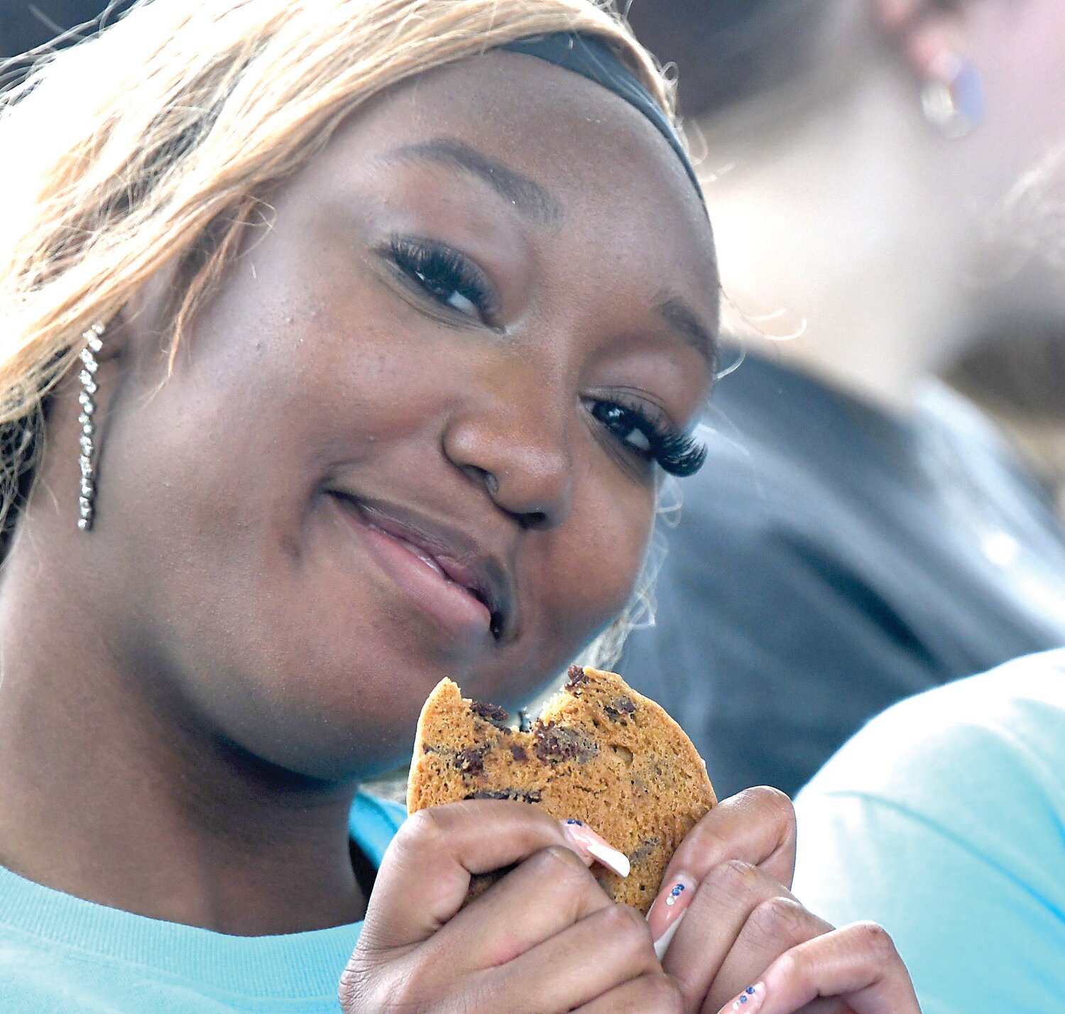 Ashley Tarr, a Bensalem HS senior, enjoys a cookie at Sophia’s Senior Tailgate.