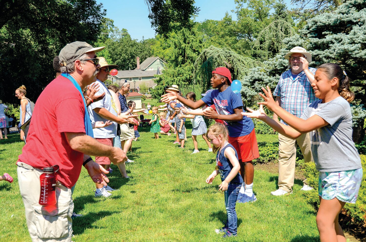 Visitors to a previous BBQ Bash take part in a balloon toss game at Peddler’s Village.