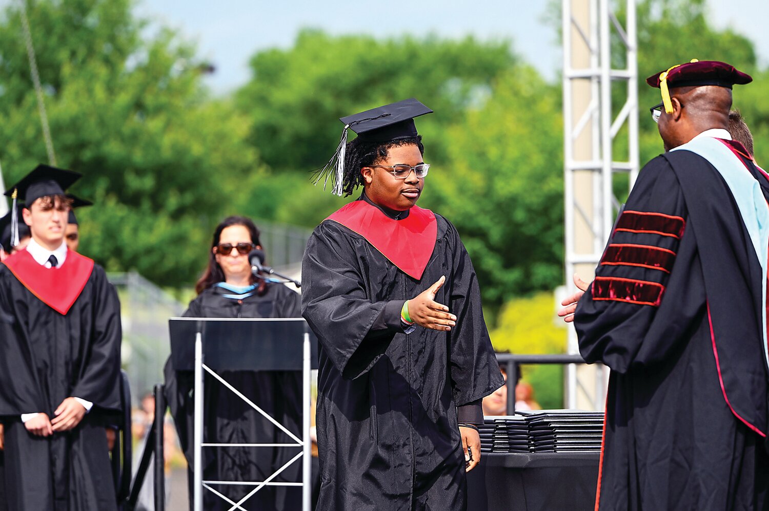 A William Tennent senior steps on stage to receive his diploma.