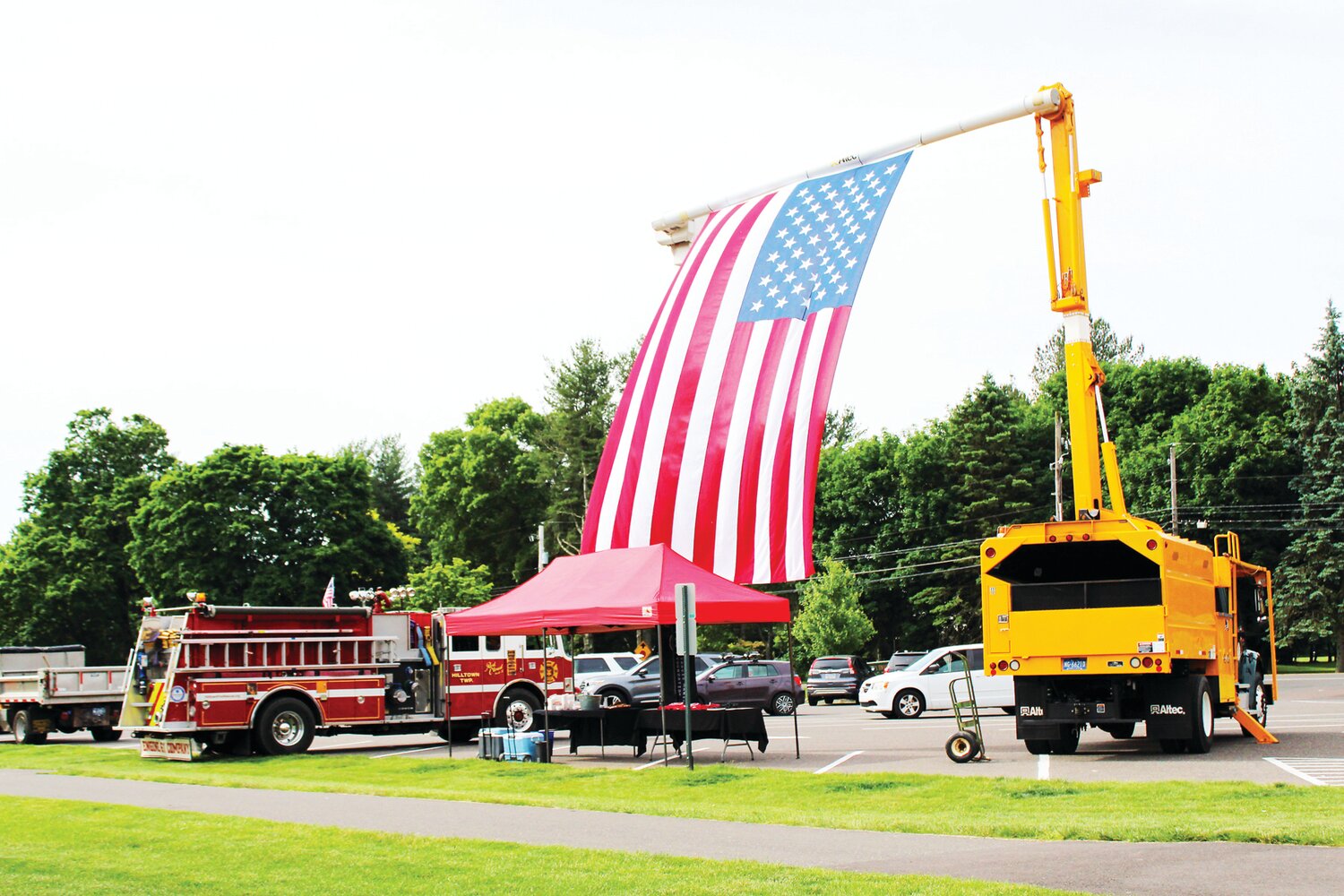 A flag, borrowed from ATS Tree Services, hangs during a tree-planting event hosted  Hilltown Township Public Works and the Travis Manion Foundation.