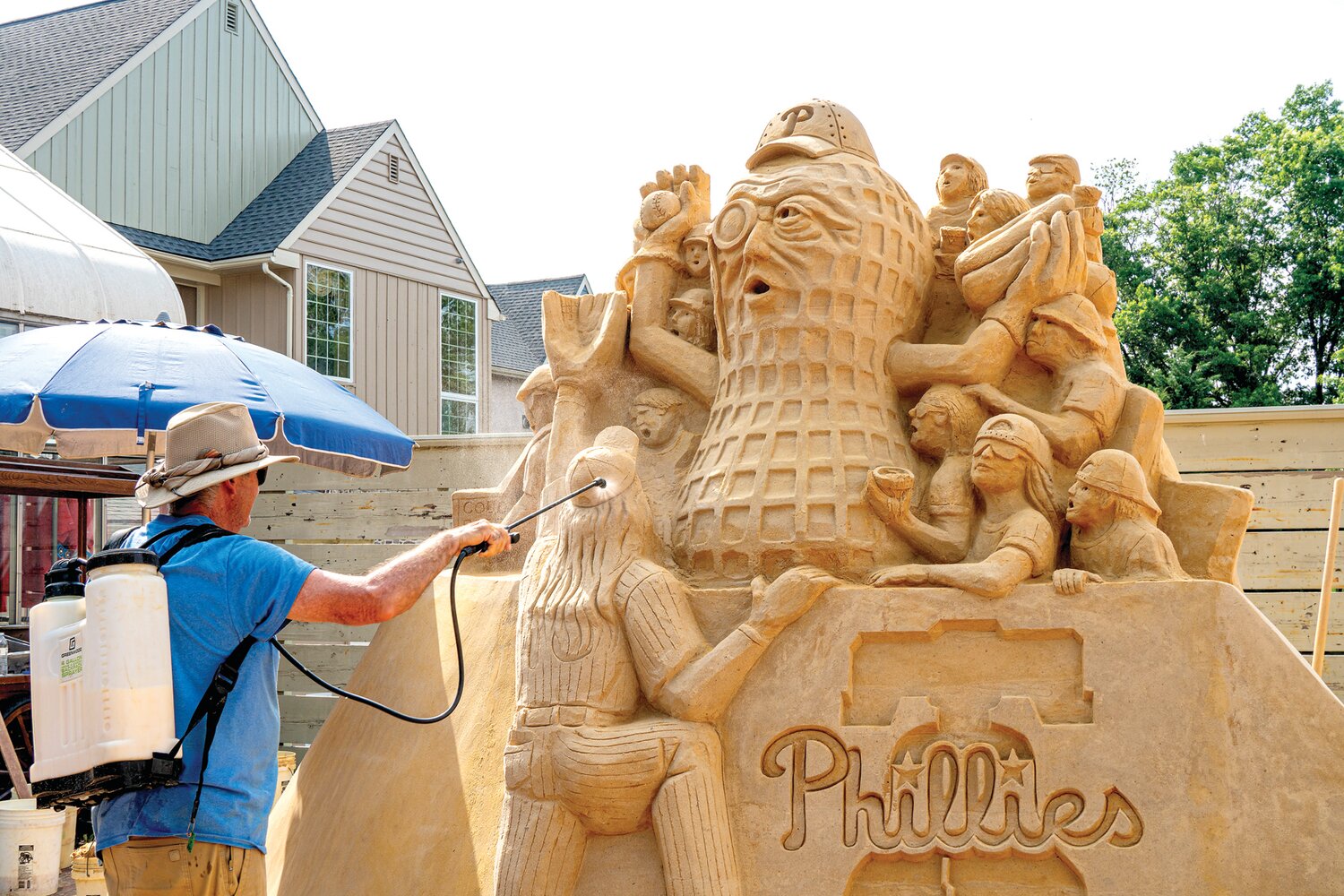 Master sand sculptor John Gowdy works on his creation at Peddler’s Village.