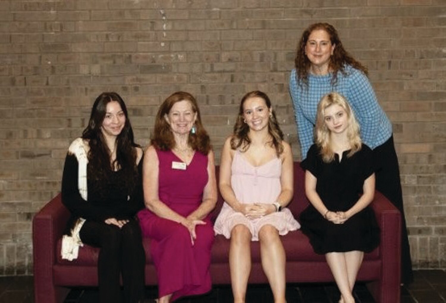 Nancy Larkin-Taylor, Bucks for Kids, second from left, sits with MBIT students, from left, Jade Perez, Abigail Rickards and Makayla Bock. Standing is Philanthropy Club coordinator Pam Swoyer, of MBIT.