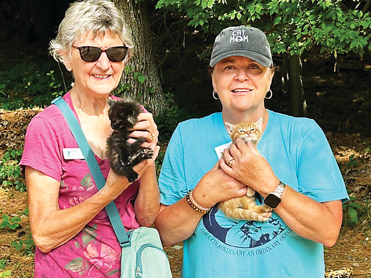 Donna Line, left, of YMCA Camp Mason in New Jersey, and Donna Gellert, of Bucks County, recently teamed up to trap-neuter-return members of a cat colony at the YMCA.
