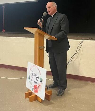 The Rev. Andrew Brownholtz, pastor of St. Ignatius of Antioch,Yardley, gives welcoming remarks.