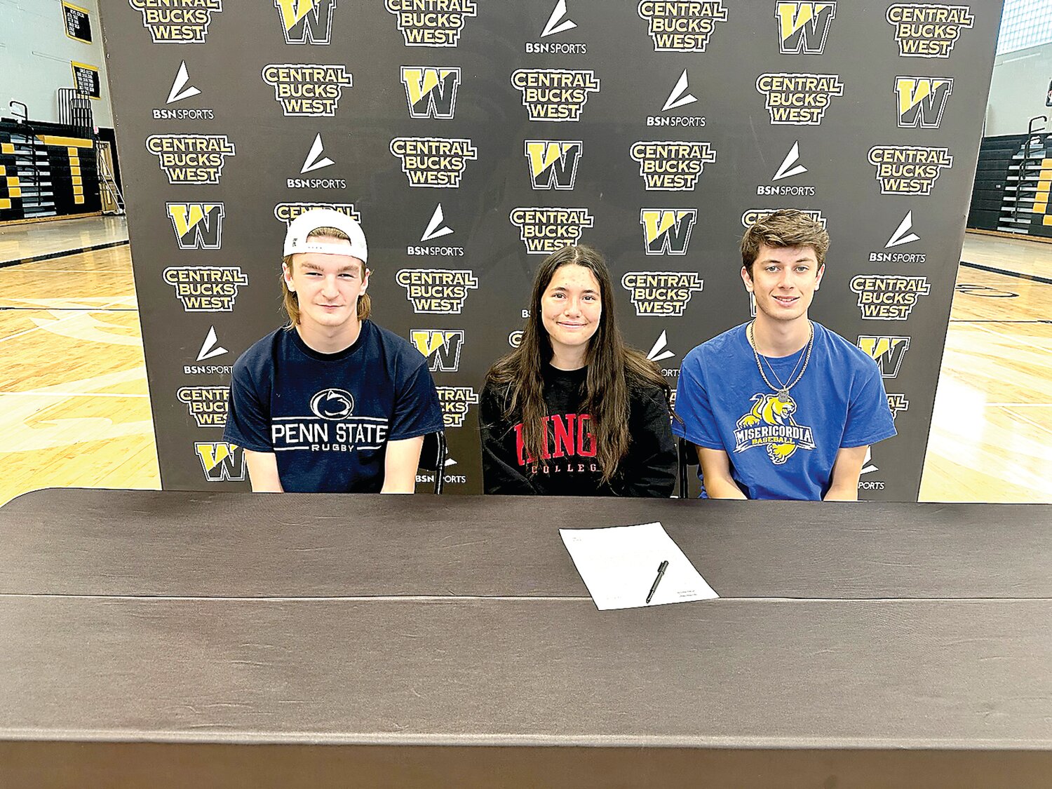 Central Bucks West recently recognized seniors, from left, Andrew Gilroy, Ava Mattes and Carter Benson for their commitment to compete in collegiate sports.