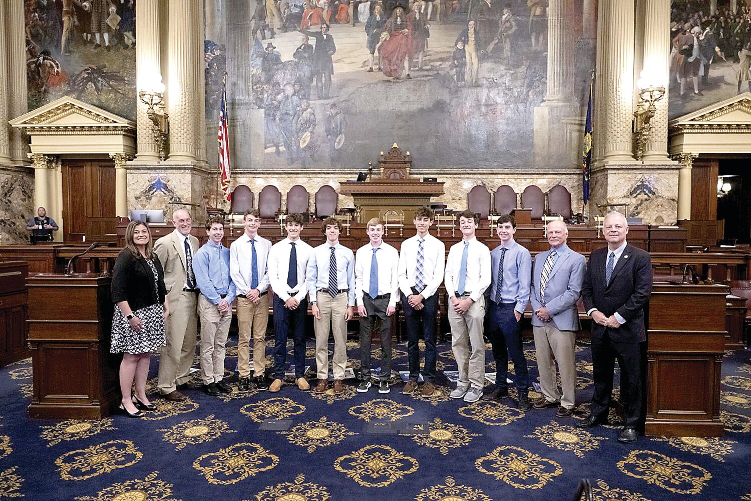 State Reps. Perry Warren and Kristin Marcell with the 2023 PIAA champion Council Rock North boys cross country team.