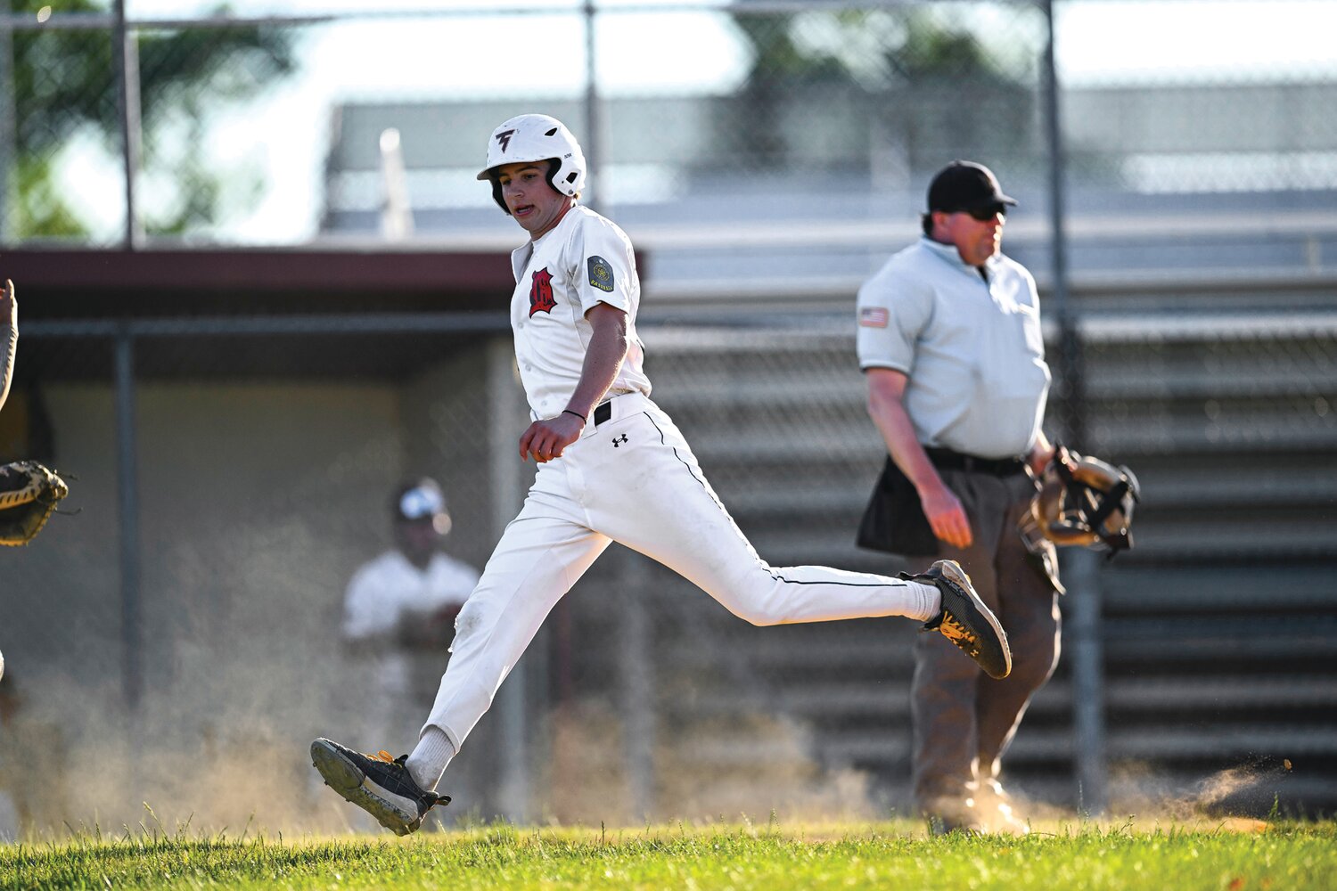 Doylestown’s Connor Grzywacz scores in the second inning, extending the lead to 8-0.