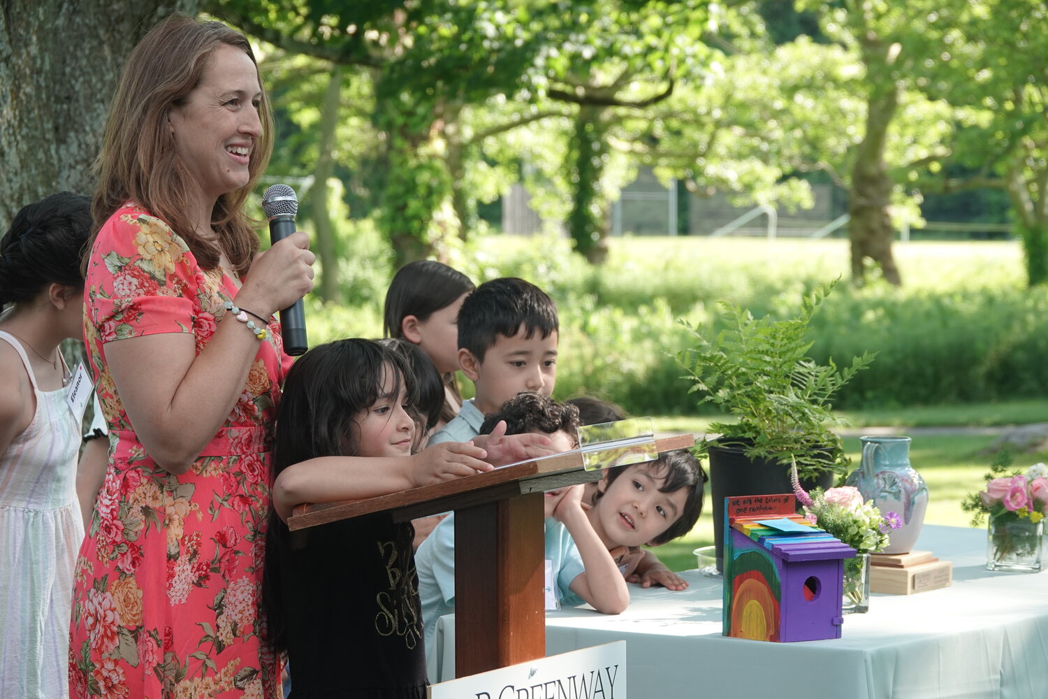 The young families of Bahá’í showed off colorful birdhouses that served as word boxes for guests to share their thoughts on preserving and caring for land.