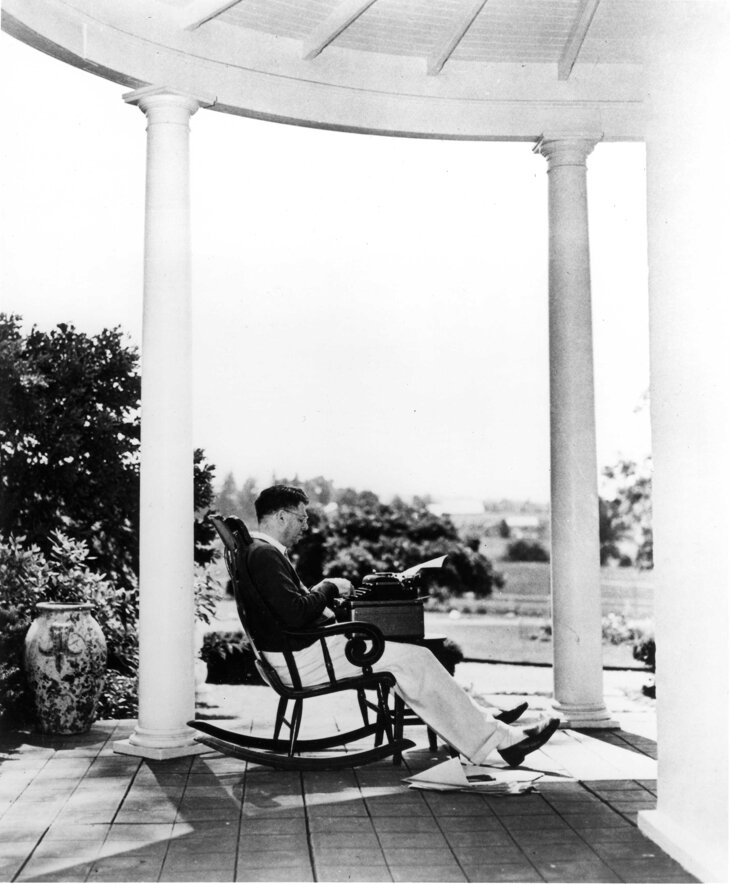 Oscar Hammerstein II typing on the front porch at Highland Farm.