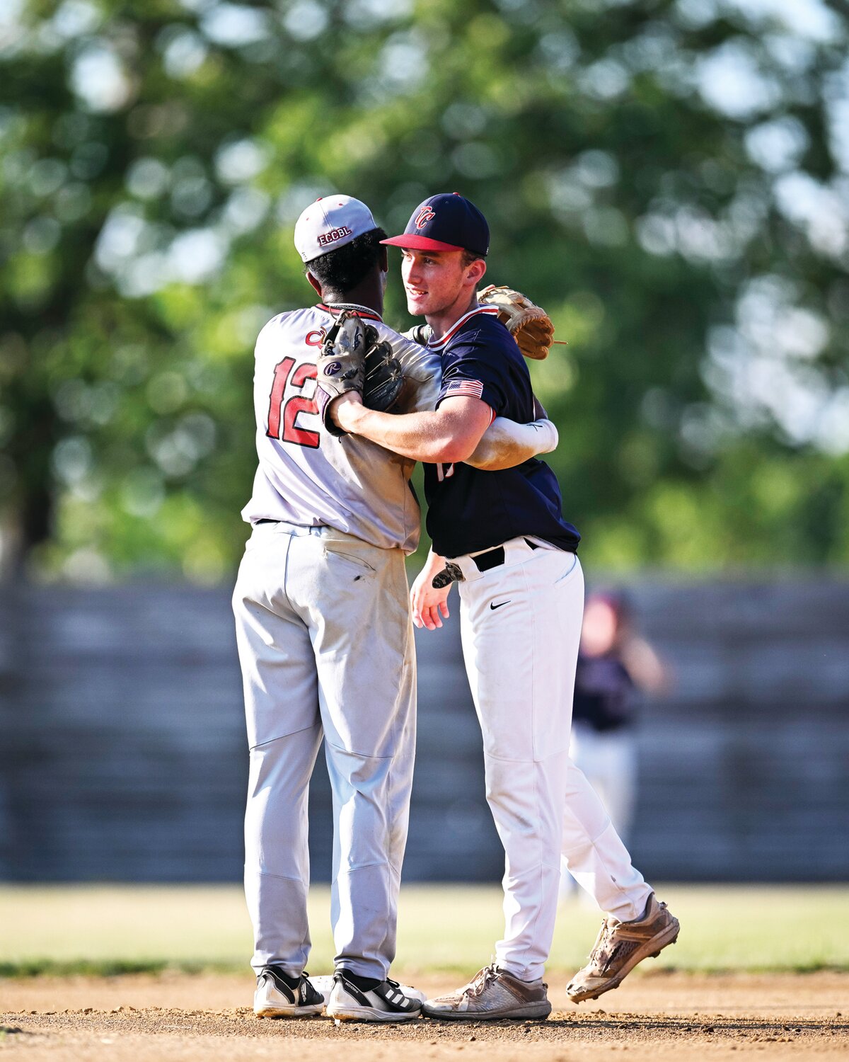 ECCBL Southern All-Stars Ahmir Cournier, of the Mercer Mammoths, and Jack Tallent, of the Trenton Capitals, catch up before the start of the game.