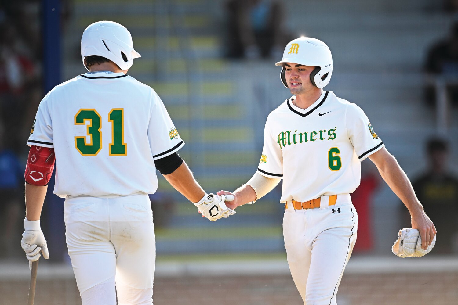 ECCBL Northern All-Star Jack Mathis, a member of the Scranton/Wilkes-Barre Miners, gets a handshake from Jake Millan after scoring in the first inning.