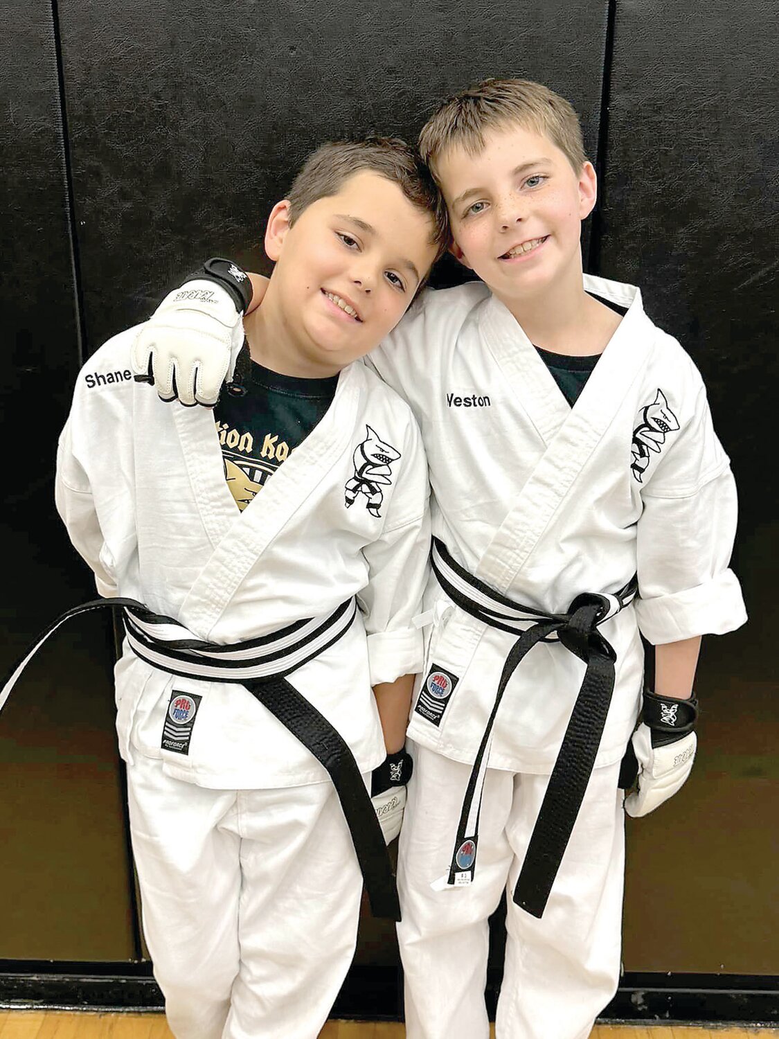 Twins Shane and Weston Fox, 9, of Warrington, are pictured after they were awarded their junior black belts at Action Karate in Jamison.