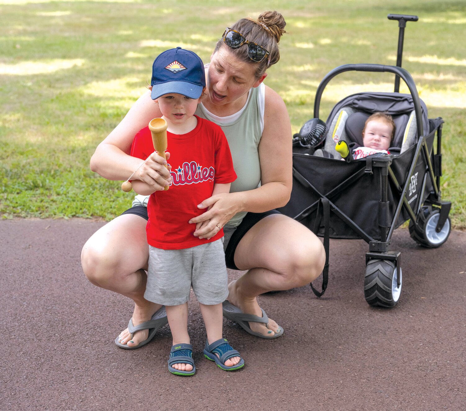 Candice Warren helps Lachlan O’Toole with the cup and ball.