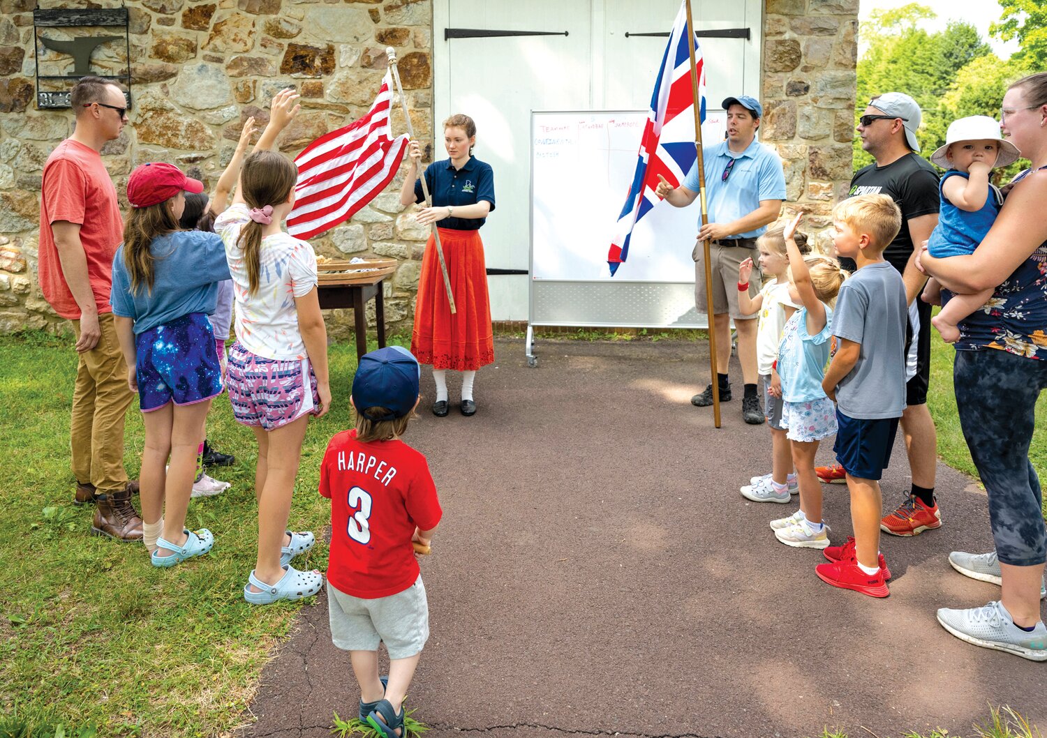 Corrine Kauermann, historical interpreter, educational programming team, and Kevin Zimmerman, historical interpreter, educational programming team, Friends of Washington Crossing Park, divvy up the children for the Continentals v. British teams.