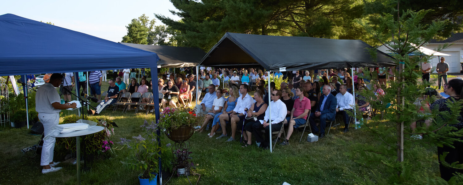 The Crossing lead pastor George Matthew Clash speaks during the memorial service for the seven victims of the flash flood that killed seven people last July.