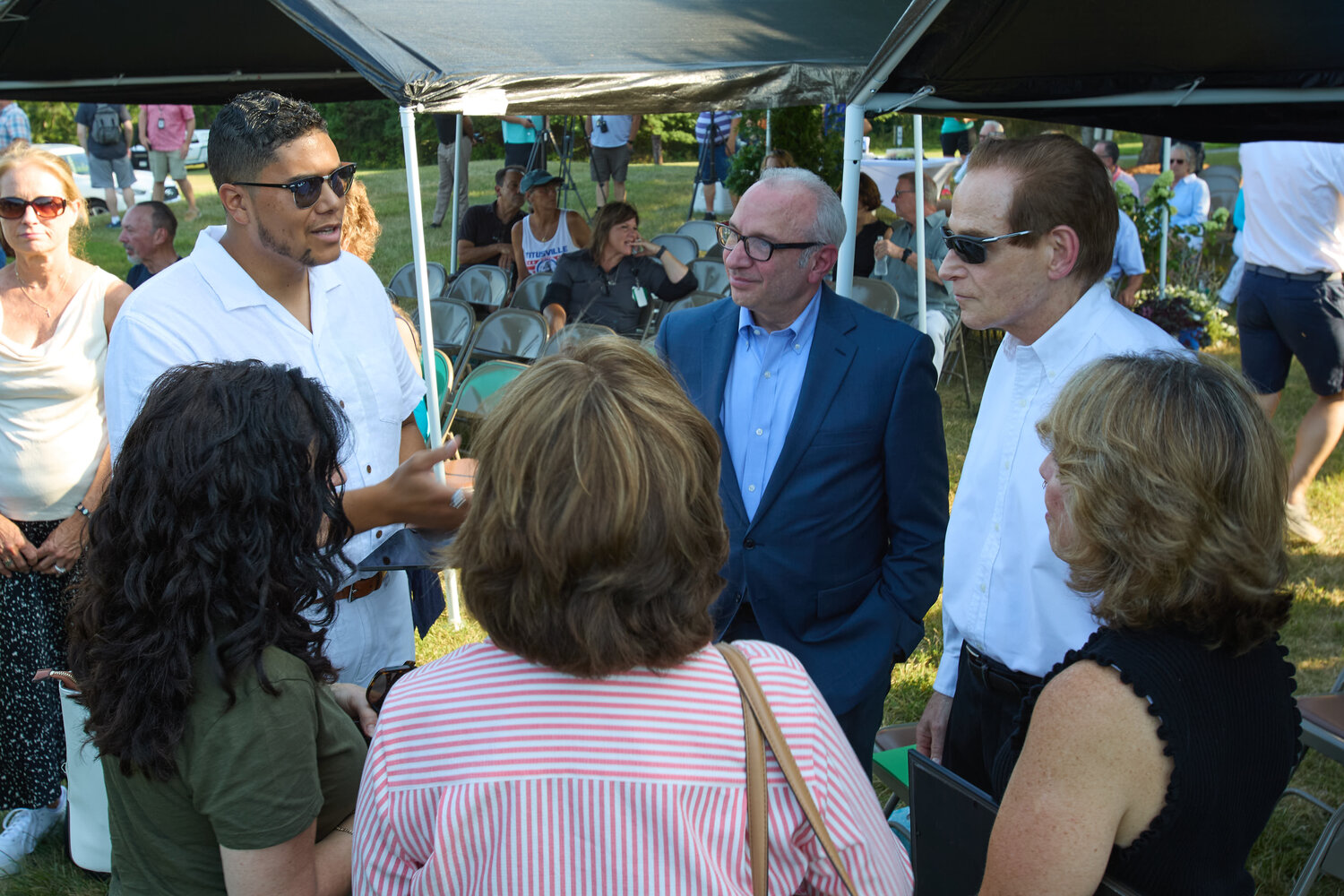 The Crossing lead pastor George Matthew Clash, left, speaks with Upper Makefield Township Supervisor Tom Cino, center, and Dave Love, right, whose wife Yuko died in the flood.