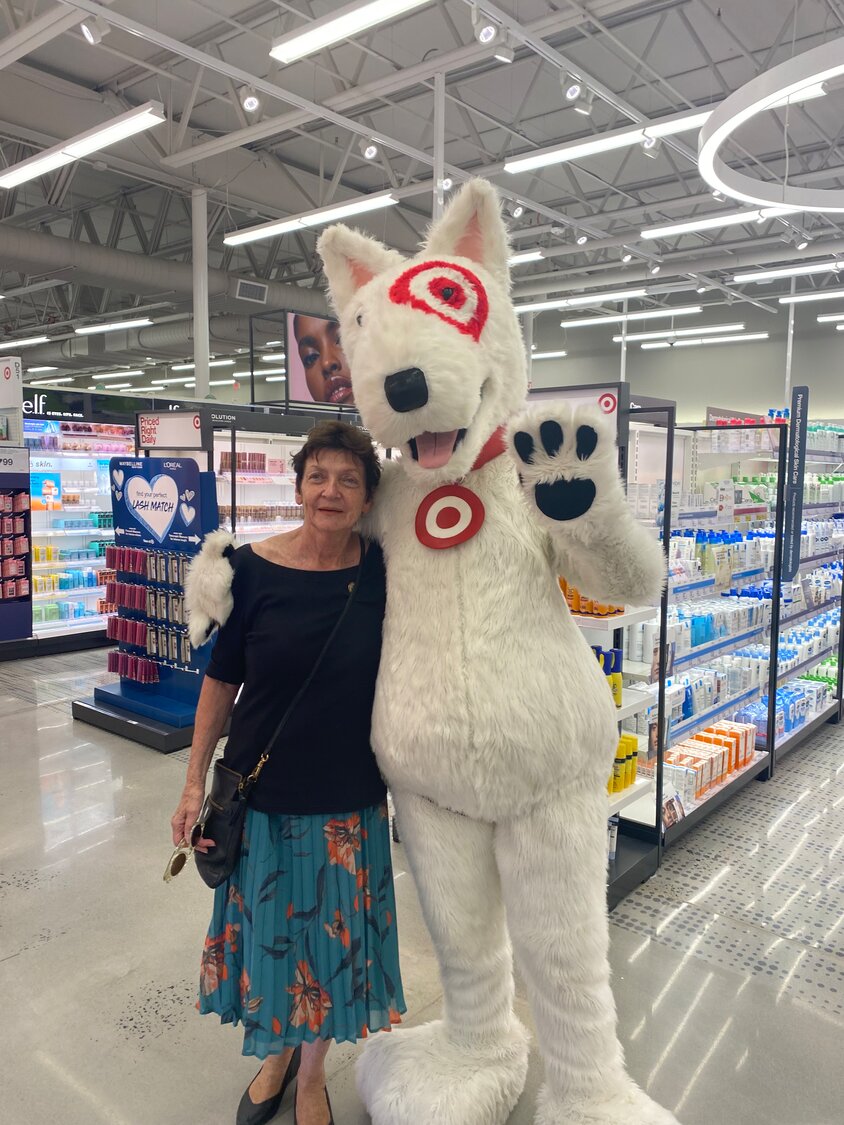 Doylestown Borough Mayor Noni West was greeted by Target’s mascot at Monday’s ribbon-cutting ceremony.