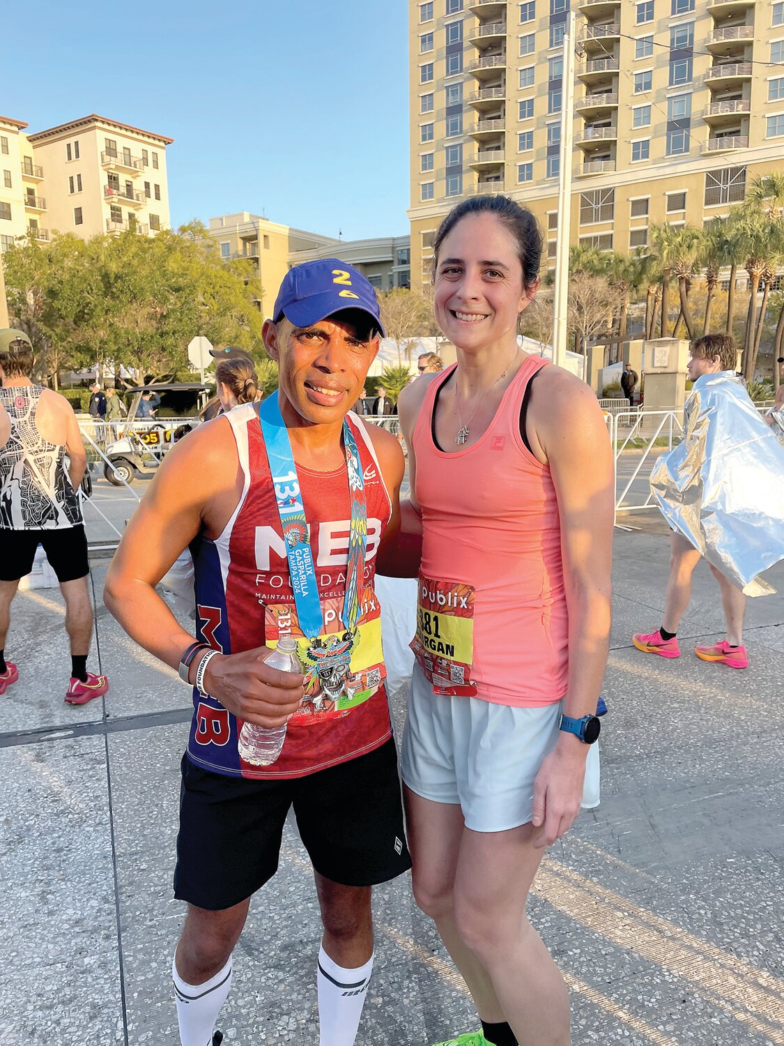 U.S. marathon great Meb Keflezighi, left, and Morgan Leh chat after last February’s Gasparilla Half-Marathon.