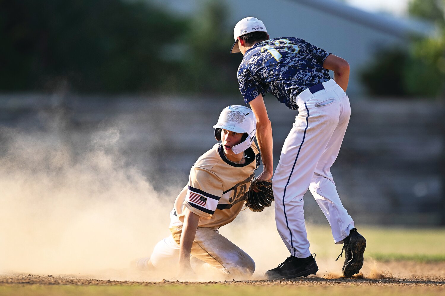 Quakertown’s CJ Peacher looks around to the ump after getting called out during a fifth-inning steal attempt.