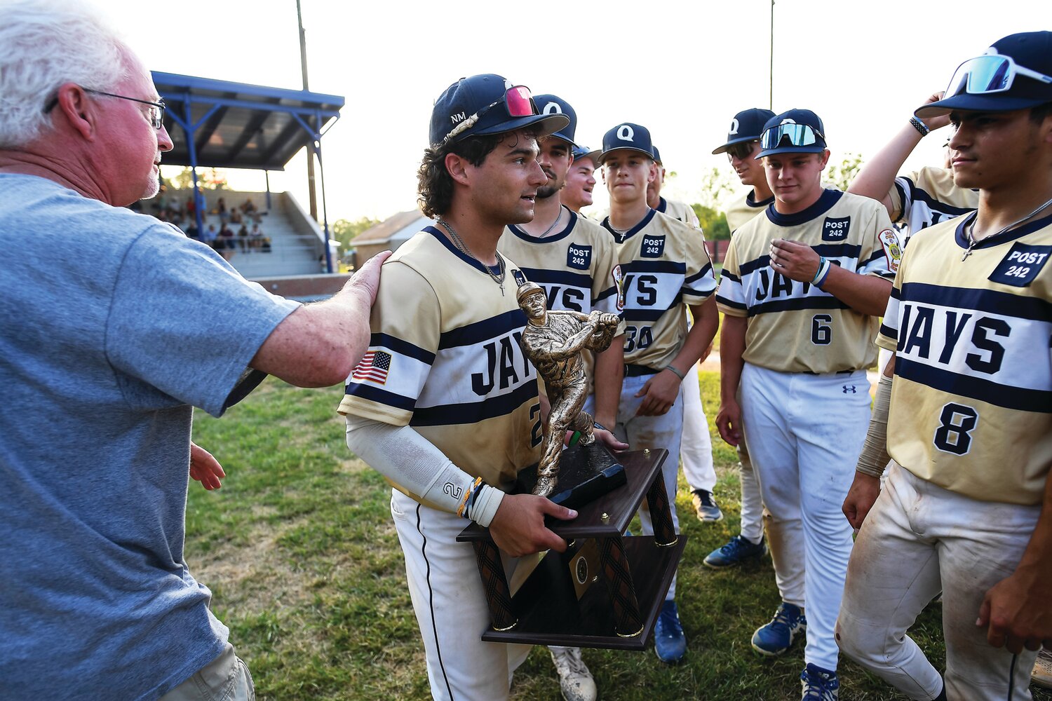 Quakertown’s Danny Qualteria gets a pat on the back after the Blue Jays defeated Perkiomen for the Bux-Mont American Legion League title Monday.