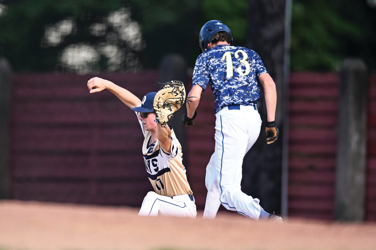 Quakertown’s Carl Weiss flashes the glove with a scoop just in time to get Perkiomen’s Jordin Dice.