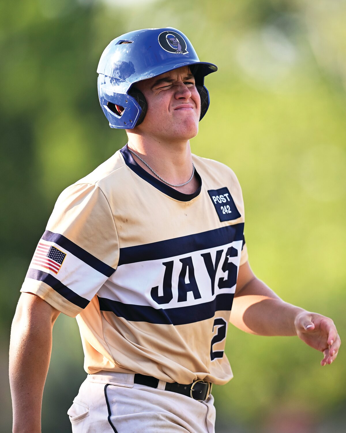 Quakertown’s Gerry Stanziola grimaces after getting hit square on the head in the fourth inning.