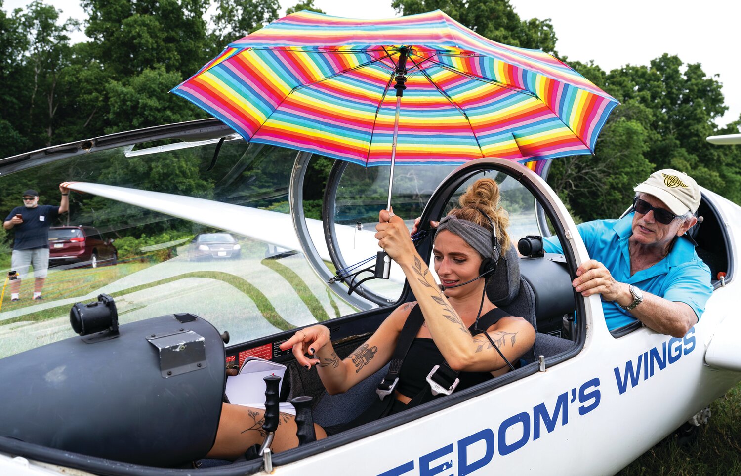 Maura Serio learns more about the glider’s controls before soaring into the sky.