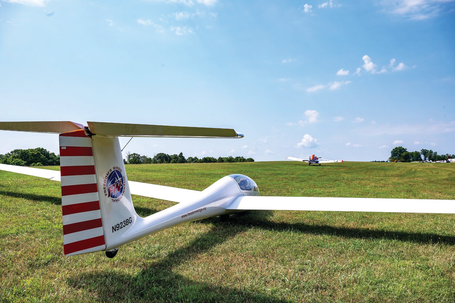 Freedom’s Wings International hosted an event Sunday, helping about a dozen individuals with disabilities get out of their wheelchairs, sit in the cockpit of a glider and soar in the sky at Van Sant Airport.