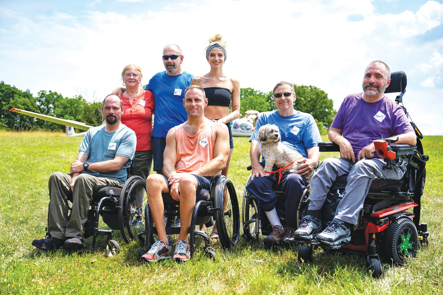 Grateful for a day of soaring above the clouds, participants from the Freedom’s Wings International event gather for a group photograph on Sunday at Van Sant Airport in Tinicum.